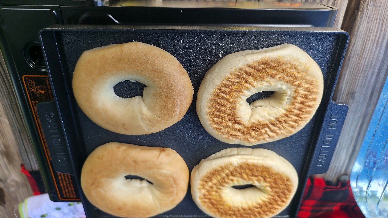 Bagels cooking on a griddle during a camping trip at Lake Louisa State Park