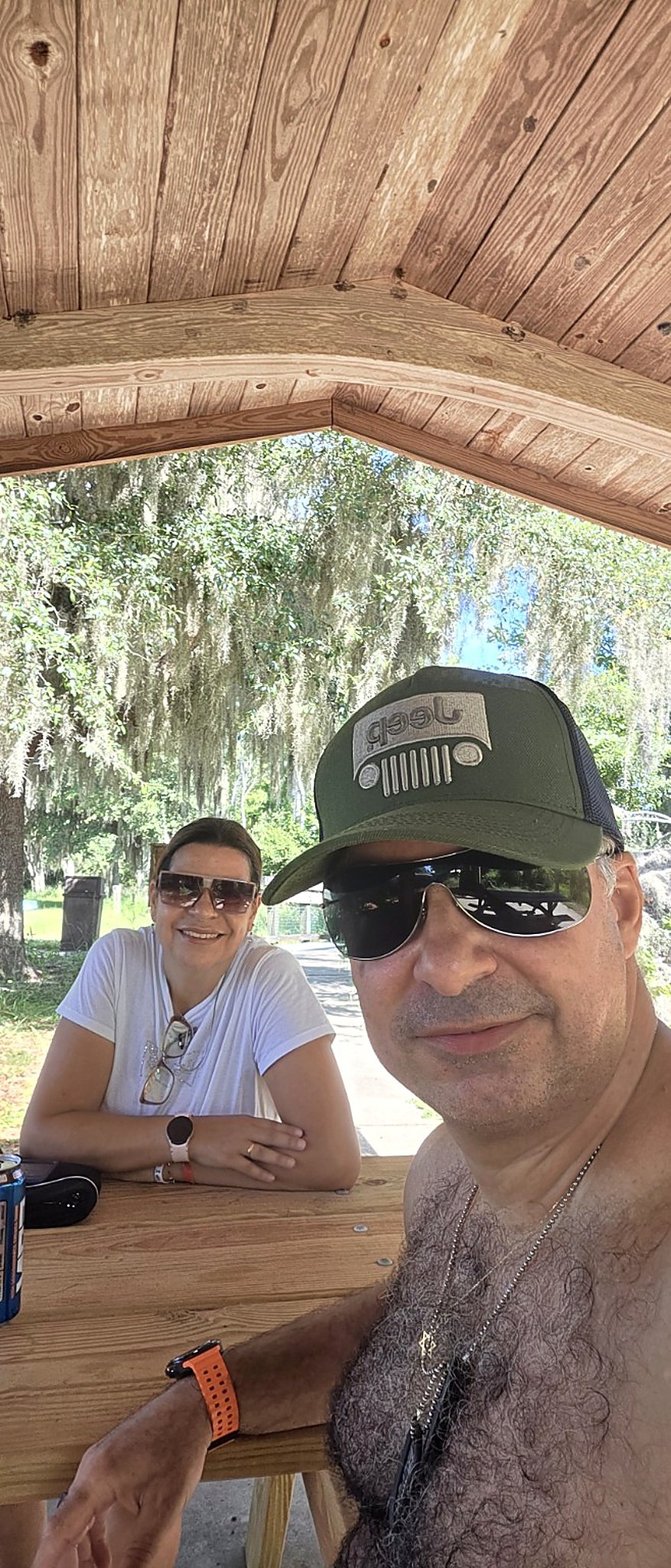 Couple seated at a picnic table during a camping trip at Lake Louisa State Park